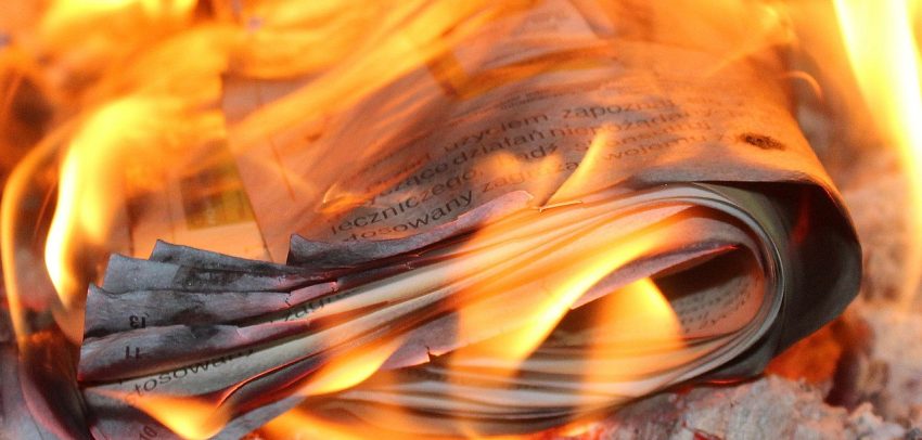 Burning newspapers